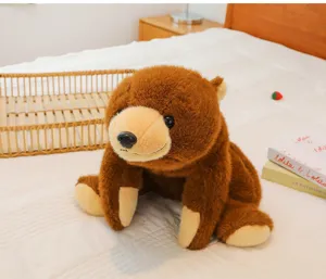 Detailed close-up of a cute brown teddy bear plush toy sitting on a cozy soft bed.