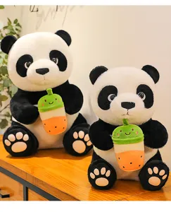 Close up view of cute panda plush toys holding sweet bubble tea cups, soft and fluffy details.