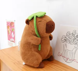 Cute capybara plush toy with clover hat, soft stuffed animal doll for gifts and home decor details.
