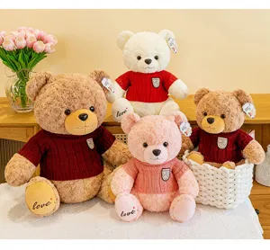 Jolis jouets en peluche d'ours en peluche avec pulls chauds, cadeaux parfaits pour enfants.