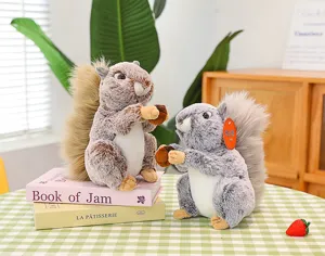 Detailed view of simulation rabbit fur squirrel plush toy holding acorn, cute display.