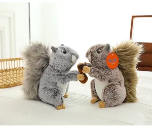 Cute squirrel plush toy detail showing soft rabbit fur texture, holding an acorn, nice gift.