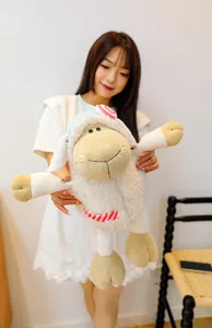 Close up view of the cute candy sheep plush toy showcased by a model, soft and fluffy texture.