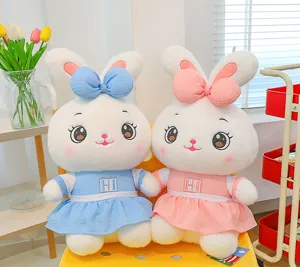 Cute couple plush rabbit toys detailed view, featuring soft white bunnies in pink and blue dresses.