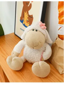 Cute plush lamb stuffed toy with fluffy white wool and pink flower for kids and girls.