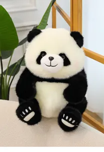 Cute panda plush toy close up, soft fluffy fur and detailed embroidered paws for gift.