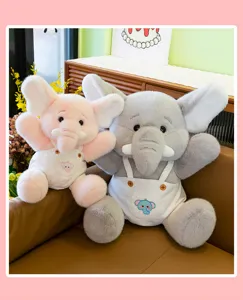 Close-up of cute plush elephant toy detail, soft fluffy fabric texture and lovely overalls style.