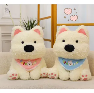 Cute sitting West Highland white terrier plush toy detail view, soft stuffed dog doll with bib.