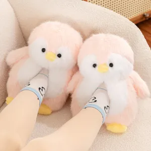 Cute plush penguin slippers for women, soft cozy winter indoor warm home shoes in pink.