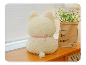 Cute white puppy plush toy detail view, soft stuffed dog doll with pink bib decoration.
