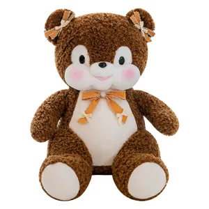 Bruine pluche berenknuffel met leuke oranje strikjes en zachte vacht, prachtig cadeau voor kinderen.