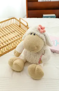 Cute plush sheep toy with pink flower, soft stuffed lamb doll for kids gift and room decor.
