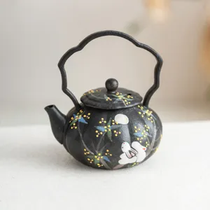 Hand-painted black ceramic teapot featuring a cute rabbit and osmanthus flower design.