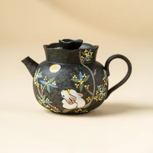 Exquisite ceramic teapot featuring a charming rabbit and osmanthus blossom design for tea lovers.