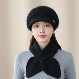 Close-up detail of the black knitted beret and cozy winter scarf set worn by the model.