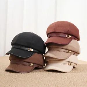 Detailed close-up shot of stylish vintage octagonal hats with leather strap and metal buckle.