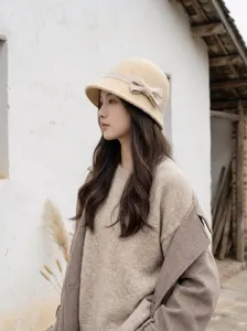 Audrey style wool felt bucket hat for women, vintage bow knot elegant winter accessory.