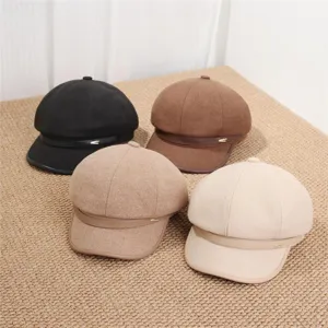 Detail shot of four autumn retro octagonal painter hats in various stylish colors and soft fabrics.