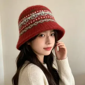 Red knitted bucket hat for women, winter warm wool blend cap with classic Nordic pattern.