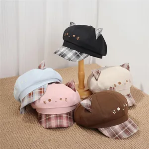 Close-up details of sweet and cool style cute cat ear beret hats in various colors with plaid brim.