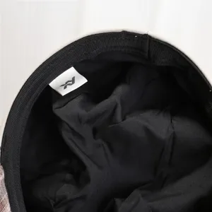 Detailed view of the Japanese retro vintage women's beret hat interior lining and brand tag.