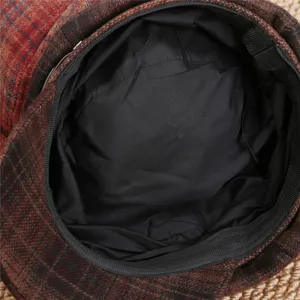 Retro plaid octagonal cap detail shot showing inner lining and premium tweed fabric.