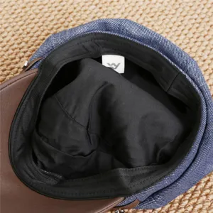 Detail view of vintage denim patchwork newsboy cap interior, stylish autumn women painter hat.