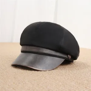 Classic black newsboy cap for women with distressed brown leather brim, retro autumn style hat.