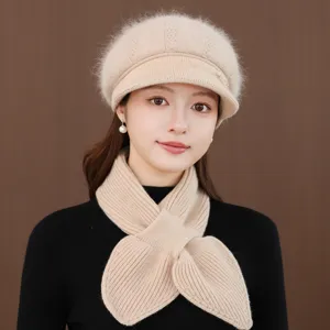 Detailed view of the women winter warm wool knitted beret hat and scarf set in elegant beige.