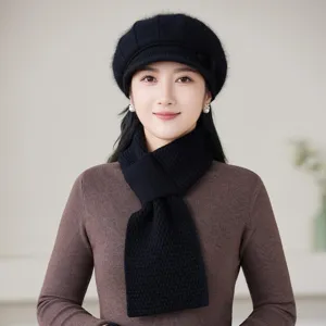 Cozy black knitted beret and matching warm scarf worn by model, stylish winter look.