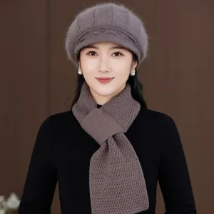 Detailed view of the women's knitted beret and matching scarf set, cozy autumn winter warm wool hat.