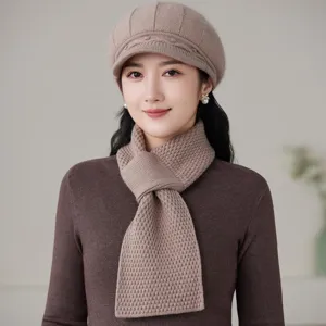 Close-up detail view of the winter warm knitted beret and matching scarf set in cozy khaki.