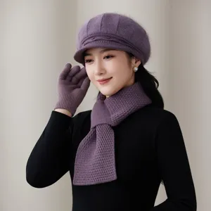 Detailed view of women purple knitted beret scarf and gloves set for winter cozy warm