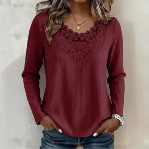 Close-up of women's long sleeve waffle knit top featuring elegant V-neck lace patchwork details.