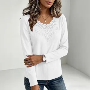 Detail view of a white waffle long sleeve women top featuring elegant lace V-neck splice design.