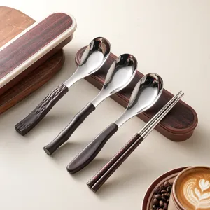 Portable 304 stainless steel spoon and chopsticks set with stylish wood grain handles.