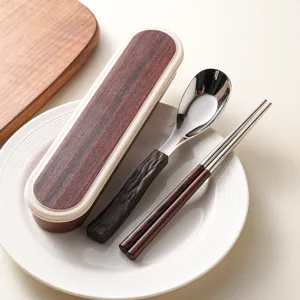 Portable stainless steel cutlery set with wood grain spoon chopsticks and storage box.