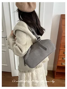 Detailed view of the vintage grey shoulder boston bag, showcasing minimalist style and texture.
