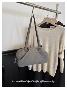 Minimalist gray Boston shoulder bag with chic handle tie detail, perfect for daily commuting chic.