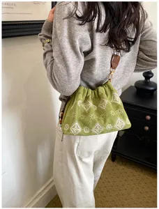 Vintage green embroidered bucket bag for women, casual shoulder bag with unique design.