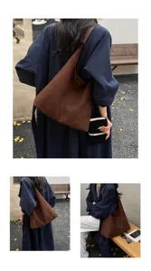 Vista dettagliata della borsa hobo marrone morbida stile urbano esterno look lifestyle.