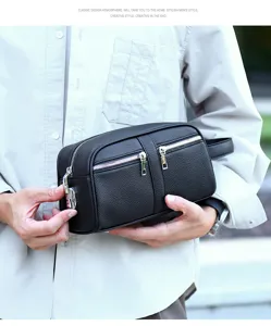 Men's black leather clutch bag with multiple zipper pockets and side handle for business casual.