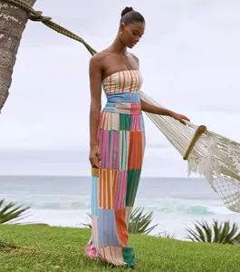 Detail shot of colorful striped strapless tube top and matching pants resort wear set.