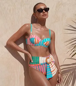 Colorful striped bikini detail shot, high-waisted design with side ring decoration.