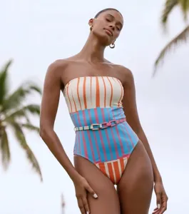 Elegant colorful striped one-piece swimsuit detail view, perfect for beach vacation and resort wear.