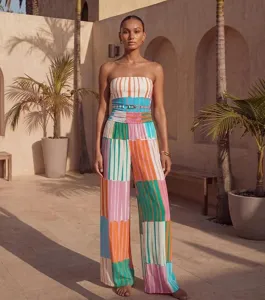 Detailed view of colorful striped strapless jumpsuit, elegant resort beach wear style for women.