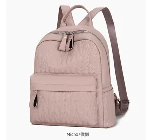 Stylish pink quilted leather backpack for women, casual daily school bookbag with zippers.