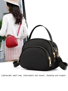 Stylish nylon mini crossbody bag for women, multi-zipper casual small shoulder handbag.