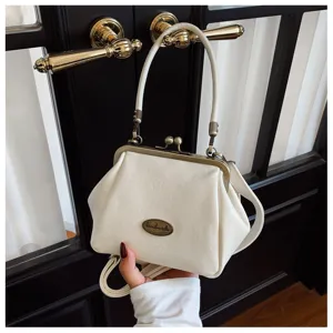 White retro solid color kiss-lock cross-body mini shoulder bag for women, fashion autumn style.