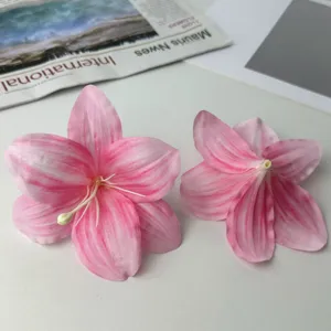 Artificial silk lily flower head detail, pink DIY craft decorative floral accessory.